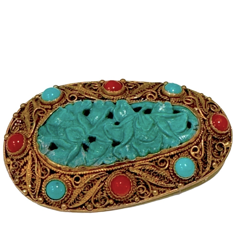 Vintage deco brooch features turquoise and coral stones. EUC
